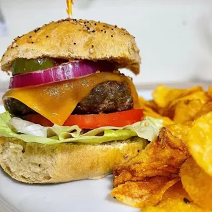 House pattied burger, house pickled onion, house made ketchup, lettuce, tomato, pickle, mayo &amp; grainy mustard on a house made bun.