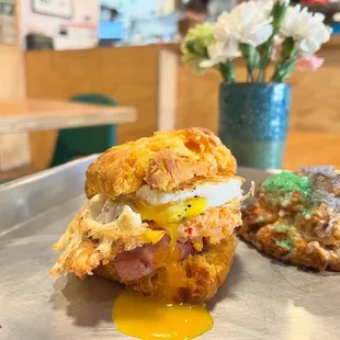 Sweet Potato Biscuit Sammie.  Sweet potato biscuit, fried egg, ham &amp; Greenhouse Pimento Cheese!