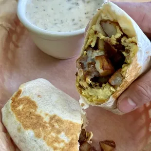 Potato, eggs &amp; cheese Breakfast burrito with a side of gravy