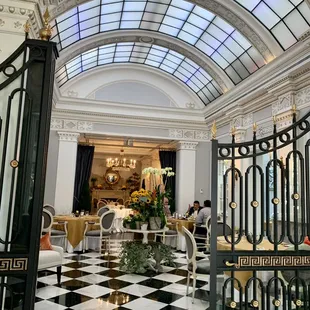 Located straight ahead once through the Jefferson Hotel lobby doors. Skylight brings tons of natural light into this colonial era ambience.