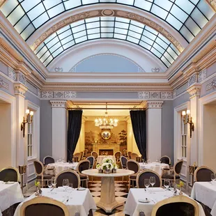 a dining room with a skylight