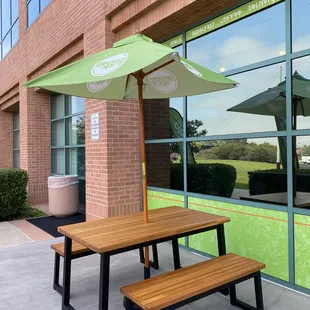 a picnic table and umbrella