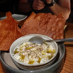 The House-Made Stracciatella was the gooey inside of a burrata ball served with sourdough crackers.