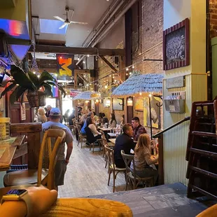 people sitting at tables in a restaurant