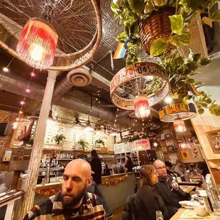 a man sitting at a table in a cafe