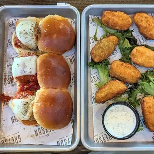 Meatball sliders and jalapeno poppers.