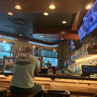 a man sitting at the bar