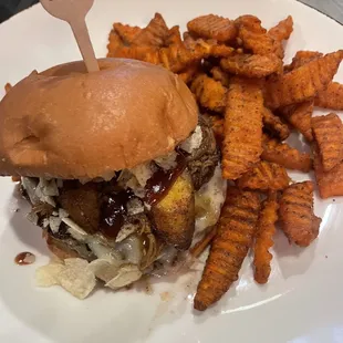 Pulled pork burger with plantains and potato chips with sweet potato fries!