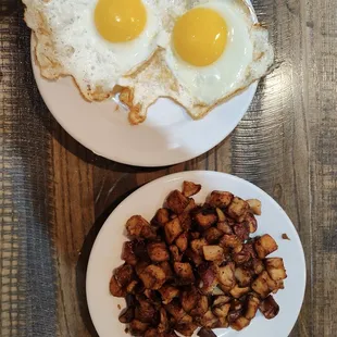 Two eggs, Sunny side up with a side of hashbrowns