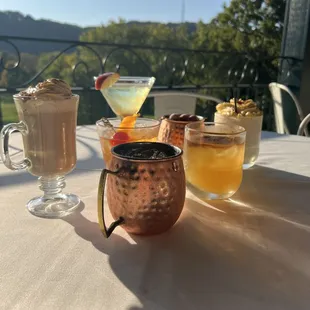 three cocktails on a table