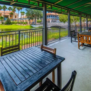 a patio with tables and chairs