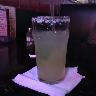 a margarita in a glass on a napkin