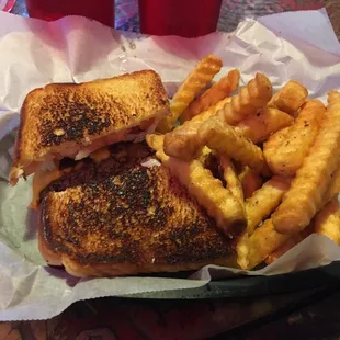 Hamburger sandwich with fries.