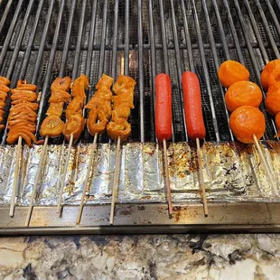 a variety of food on a grill