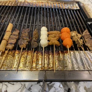 a variety of food on a grill