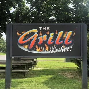 a sign for the grill