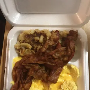 bacon and eggs in a styrofoam container