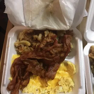bacon and eggs in a styrofoam container