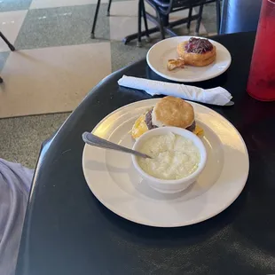 Grits with a sausage &amp; egg muffin. And the FRIED BISCUIT with cream cheese and jam.