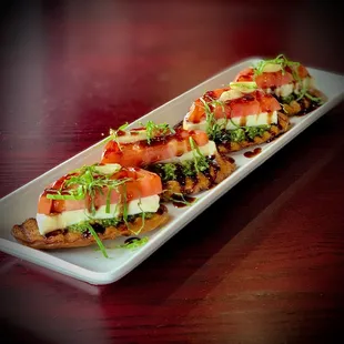 a long rectangular plate of appetizers