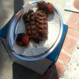 a plate of meat and rice