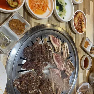 various dishes of food on a wooden table