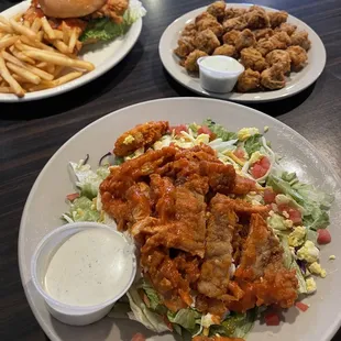 Crispy chicken salad, customized with buffalo sauce. Breaded mushrooms. Spicy chicken sandwich.
