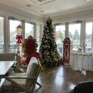 a dining room with a christmas tree