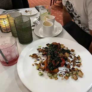 Grilled salmon with balsamic vinegar thin slice of potato on top with nuts and croutons