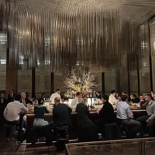 a group of people sitting at a table