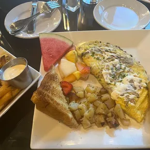 Brunch: Omelet with cream cheese and side of truffle fries.