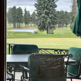 a view of a golf course from a patio