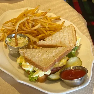 a sandwich and french fries on a plate