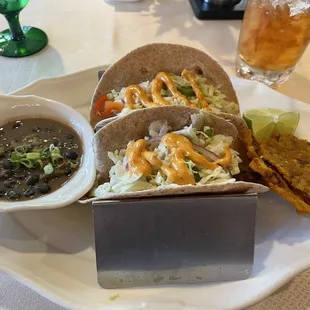 Blackened mahi mahi tacos, tostones, black beans