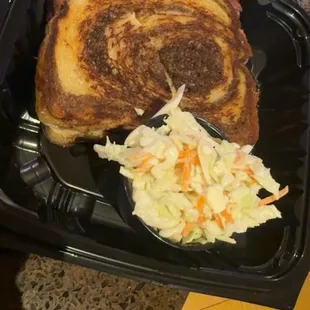 Hot Reuben sandwich and coleslaw