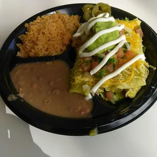 Wednesday special chicken enchiladas with green sauce, rice and beans. Includes drink for $10.75.