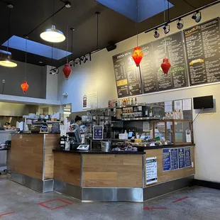 a woman standing in front of the counter