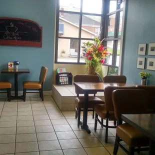a dining area with tables and chairs