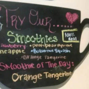 a cup of coffee with a menu written on it