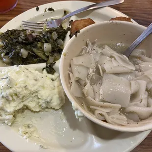 Chicken and pastry, turnip greens, and potato salad.