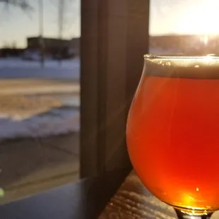 a glass of beer on a table