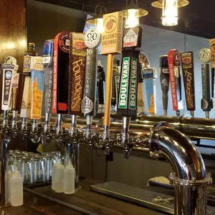 a row of beer taps
