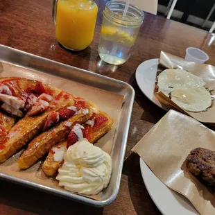 Strawberry &amp; Cream French Toast w/ sausage and over easy eggs