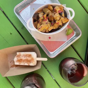 Potatoes, popsicle with tajin, and apple cider sangria
