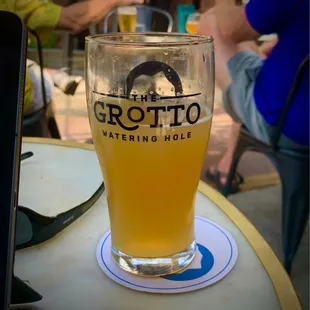 a glass of beer on a table