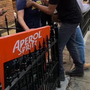 Manager held back by another staff member