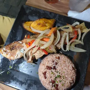 Escovitch snapper, rice and peas, and plantains.