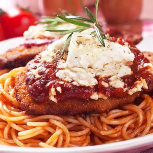 a plate of spaghetti and meat
