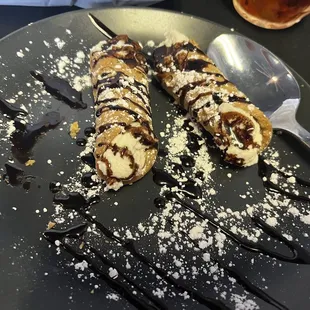 Vanilla bean cannolis. Three in an order; only two pictured because I devoured one before I realized I needed a picture.