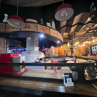 a kitchen with a counter and a bar